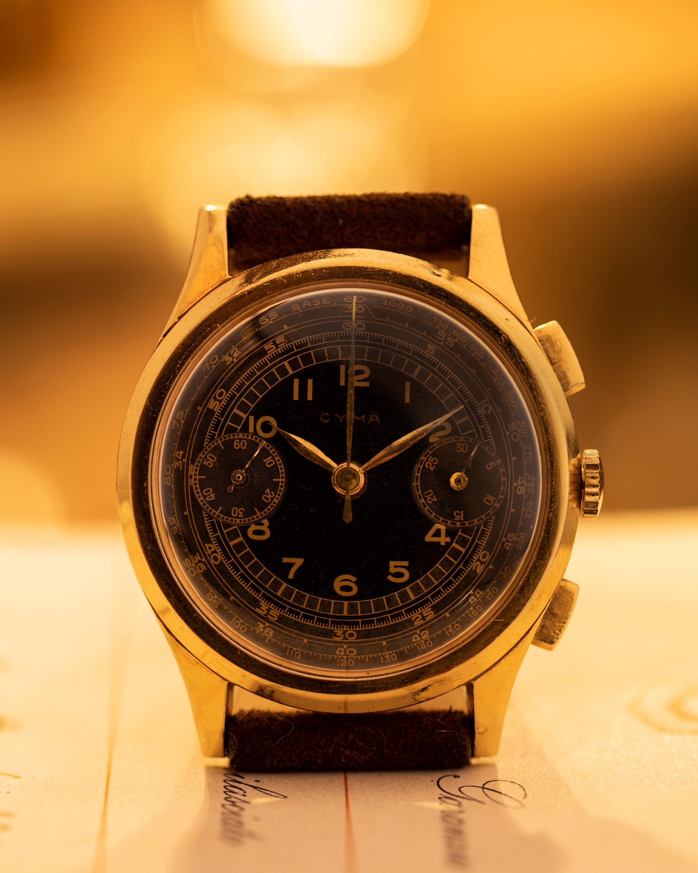 Cyma Chronograph black dial and gold case