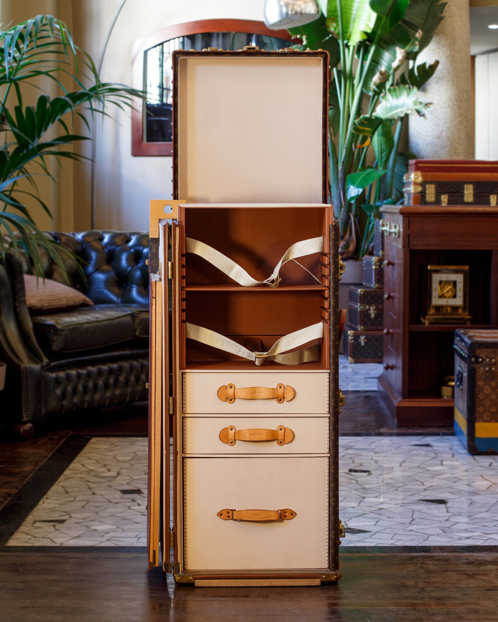 A MADE TO ORDER STOKOWSKI SECRETAIRE MONOGRAM TRUNK