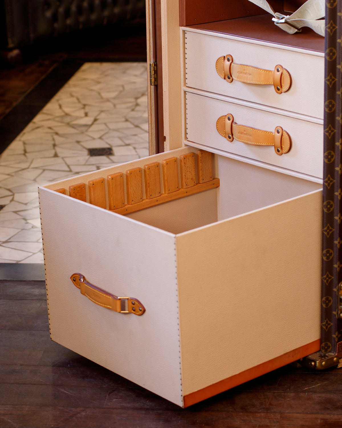 A MADE TO ORDER STOKOWSKI SECRETAIRE MONOGRAM TRUNK